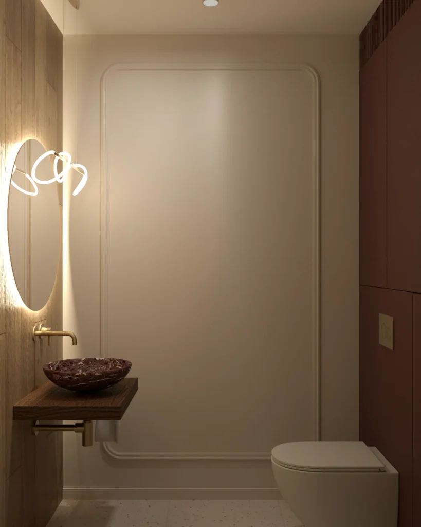 Eleganckie WC z bordową zabudową za stelażem, umywalką z czerwonego marmuru i dekoracyjną lampą LED.